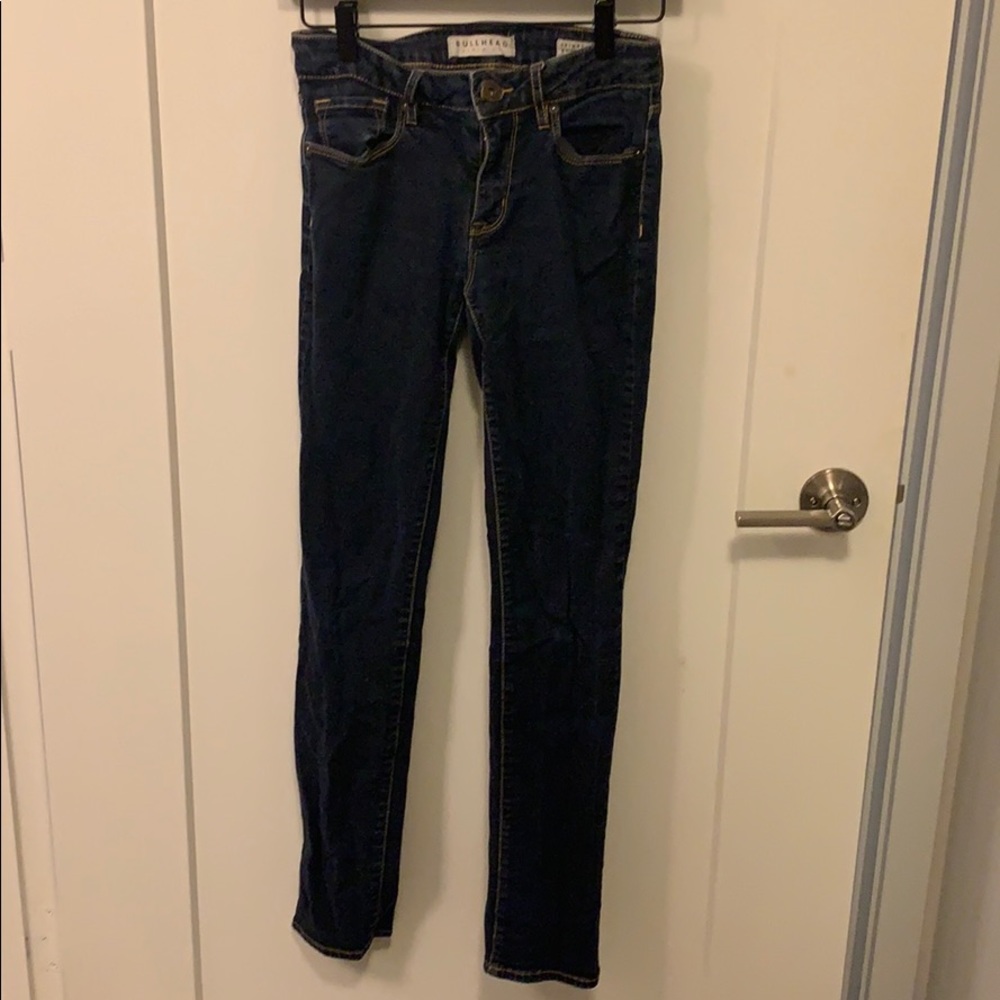 Dark wash bullhead skinny jeans.